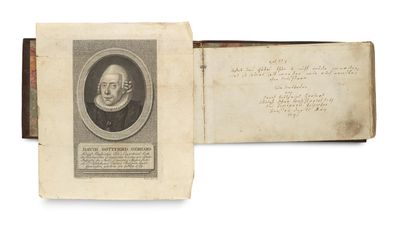 an old book with a picture of a man in a suit and tie