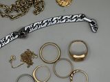 a lot of gold and silver jewelry on a table