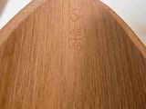 three wooden spoons that are sitting on a table