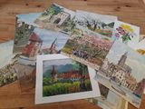 many cards that are sitting on a wooden table