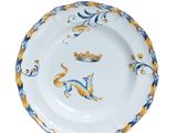 an image of a white plate with blue and yellow designs on it