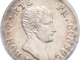 gros plan d'une pièce de monnaie sur une surface blanche avec un fond blanc