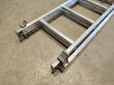 a metal ladder that is sitting on the floor