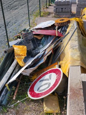a pile of junk on the side of the road