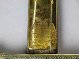 a gold plated sword with a gold handle