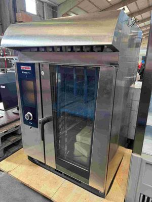 an image of a stainless steel oven in a warehouse
