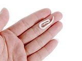 a person holding a small white object in their hand