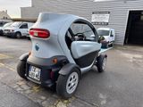 a small car that is parked in a parking lot