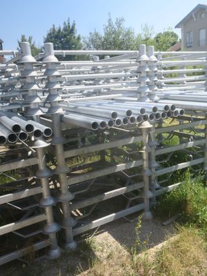 a lot of pipes that are sitting in the grass