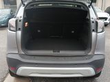 the back end of a car with its trunk open in a parking lot