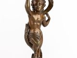 an image of a bronze statue of a cupid holding a flower