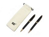 two pens and a pouch on a white surface