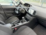 the interior of a car with a steering wheel and dashboard controls