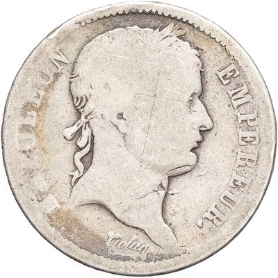 a close up of a coin with a man ' s face on it