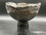 a close up of a small bowl on a table