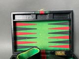 a black case with a green and red backgams in it