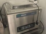 a machine that is sitting on a table in a kitchen