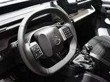 the interior of a car with a steering wheel and dashboard controls