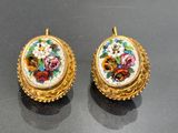 pair of gold - plated and enamel earrings with flowers