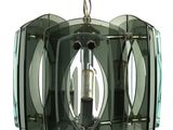 a glass chandelier hanging from a chain on a white background