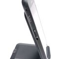 a cell phone that is sitting on top of a stand