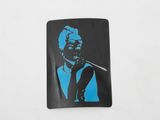 a black and blue picture of a woman smoking a cigarette