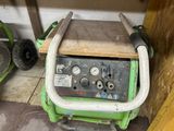 a green machine that is sitting in a room