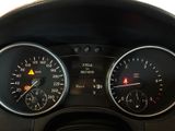 a close up of a car dashboard with various gauges