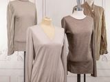 three mannequins on display in front of a white wall