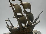 a model of a pirate ship on display on a table