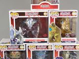 a lot of action figures in the boxes on the table