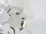 a glass vase with a flower inside of it on a table