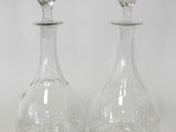 pair of clear glass decanters on a white background