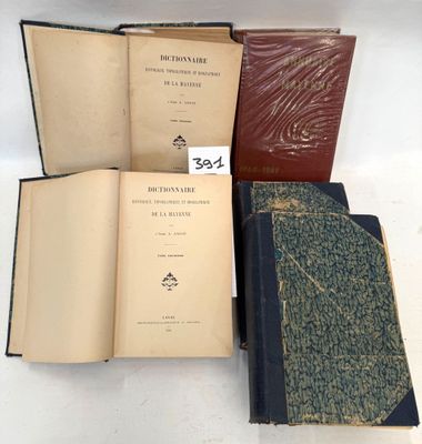 three old books sitting on top of each other on a table