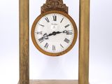 an image of a wooden clock with roman numerals on the face