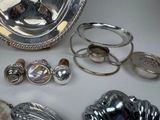 a silver plate and other silver objects on a table