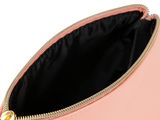 a close up of a pink purse on a white background
