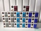 several boxes of coffee are stacked on top of each other