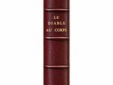 une image représentant un livre rouge orné de lettres dorées