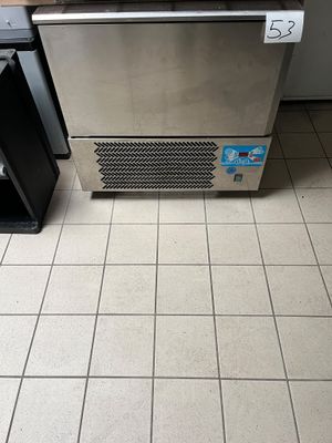 an image of a stainless steel refrigerator in a kitchen