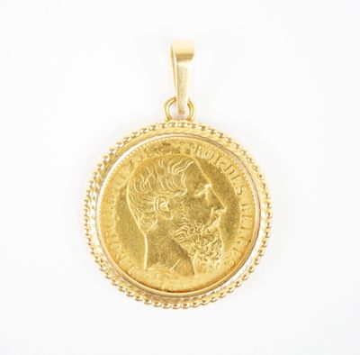 a close up of a gold coin on a white background