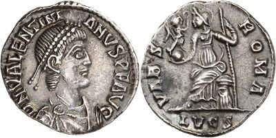 a silver coin with an image of a woman and a man on it