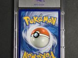 a close up of a pokemon card in a plastic case