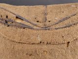 close up of a piece of fabric with holes in it