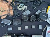 a lot of electronics that are laying out on the table