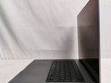 an open laptop computer sitting on top of a white table
