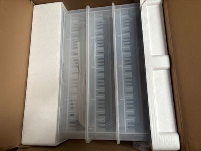 a box that has a bunch of plastic containers inside of it