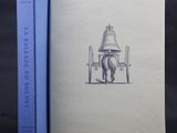 un livre ouvert sur lequel figure le dessin d'un cheval tirant une charrette