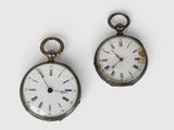 pair of antique pocket watches with roman numerals and roman numerals