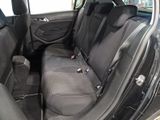 the back seats of a car are black with black trims